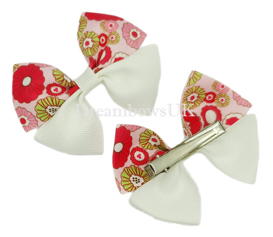 Pink and white floral hair bows on alligator clips