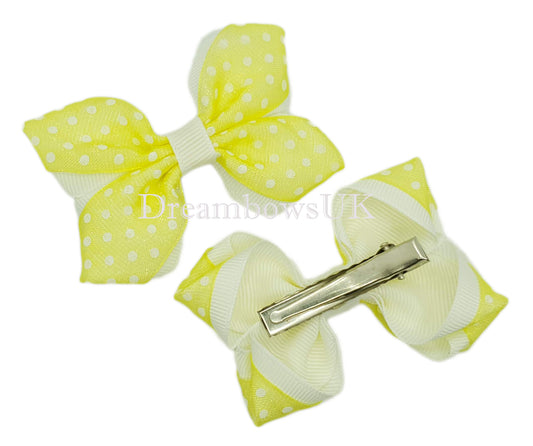 Yellow polka dot hair bows on alligator clips