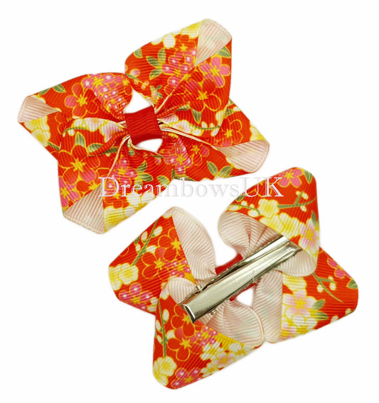 Red floral hair bows on alligator clips