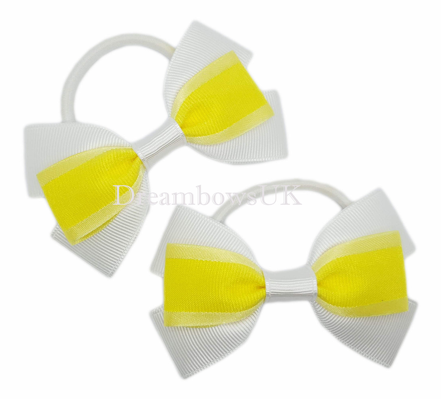 Yellow and white hair bows on thick bobbles