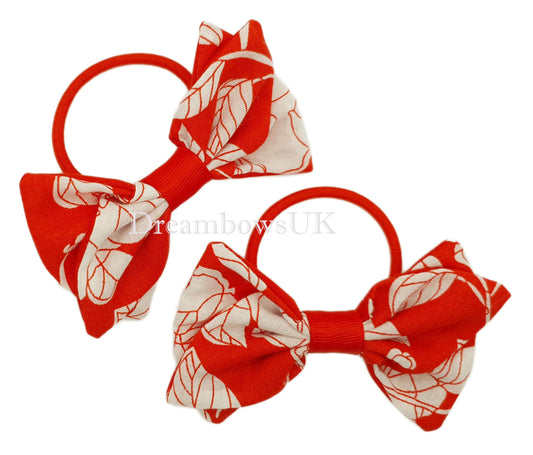 Red and white floral hair bows on thick bobbles