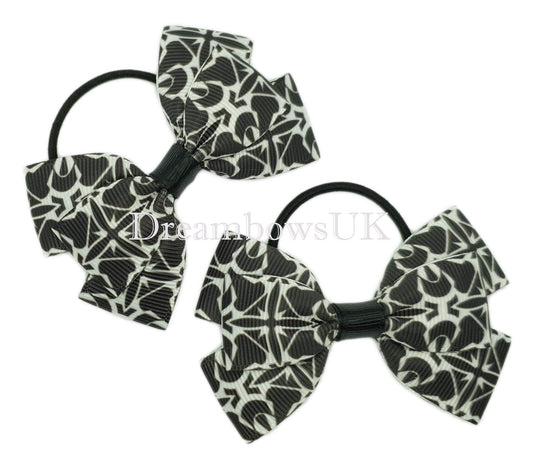 Black and white novelty bows on thin bobbles