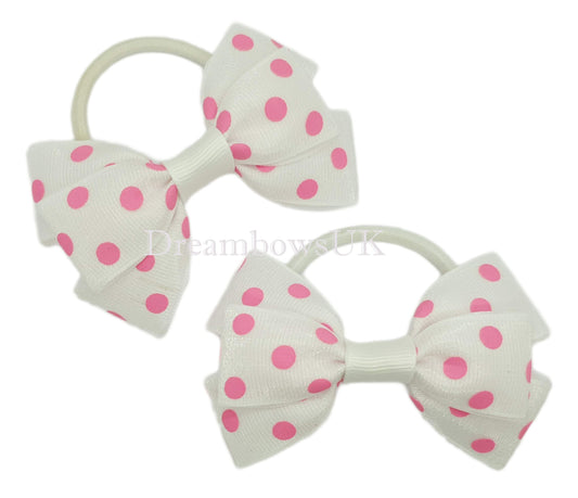 Pink and white polka dot hair bows on thick bobbles
