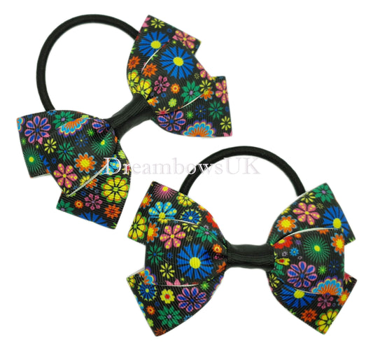 Black and colourful floral hair bows on thick bobbles