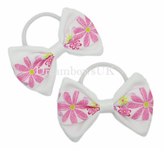 Pink and white floral hair bows on thin bobbles
