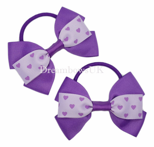 Purple and lilac hearts design bows on thick bobbles