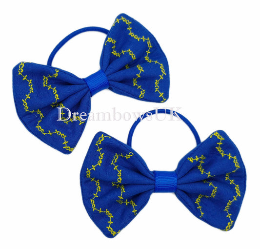 Royal blue embroidered hair bows on thin bobbles