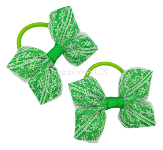 Emerald green and white lace hair bows on thick bobbles