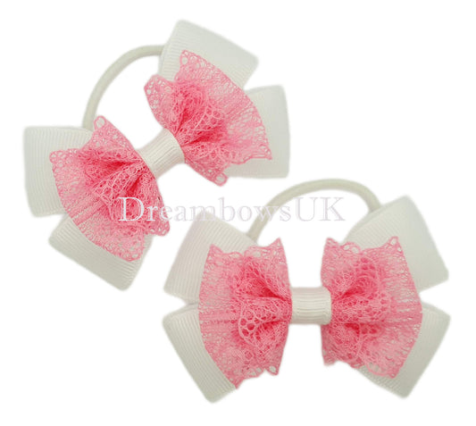Pink and white lace bows on thin bobbles