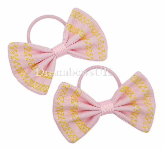 Embroidered hair bows on thin bobbles