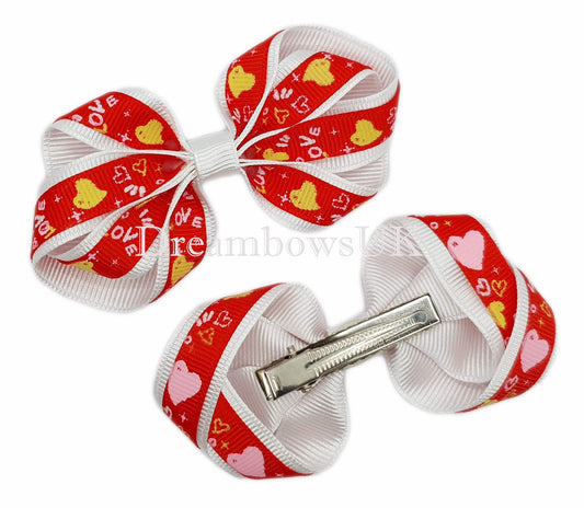 Red and white hair bows on alligator clips