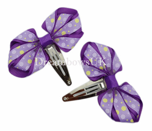 Purple polka dot hair bows on snap clips