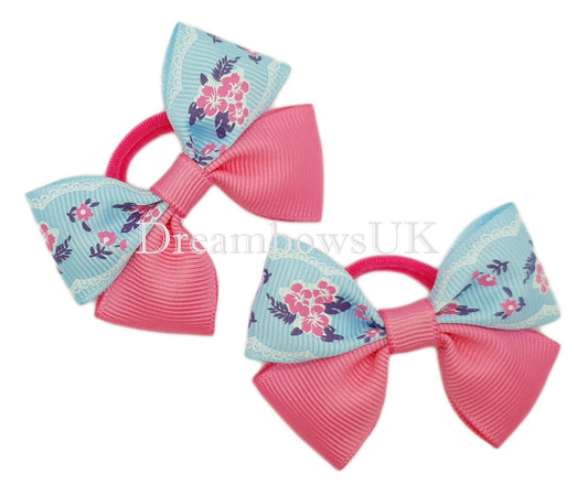 Pink and blue floral hair bows on polyester bobbles
