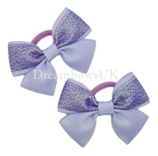 Purple and lilac glitter hair bows on polyester bobbles