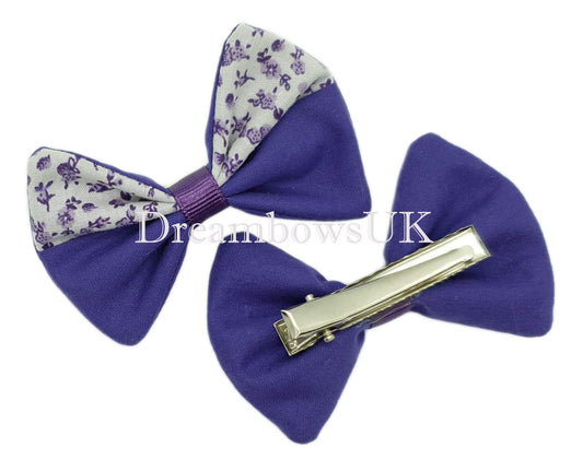 Purple and white floral hair bows on alligator clips