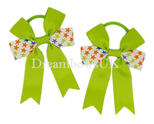 Lime green stars design hair bows on thick bobbles