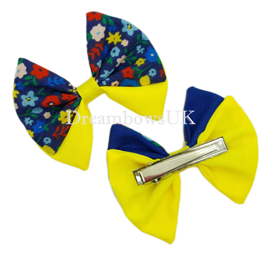 Blue and yellow floral fabric hair bows on alligator clips