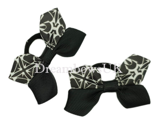Black and white baby bows on soft polyester bobbles