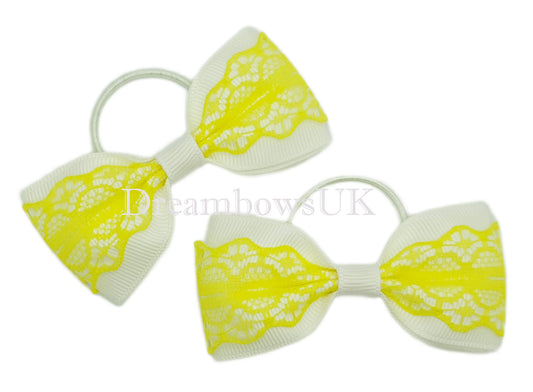 Yellow and white hair bows on thin bobbles