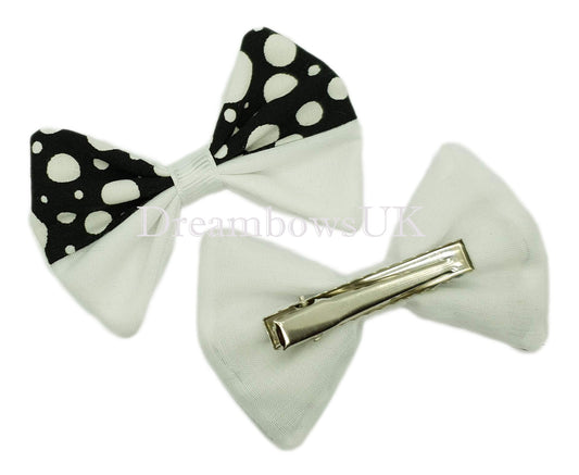 Black and white polka dot hair bows on alligator clips