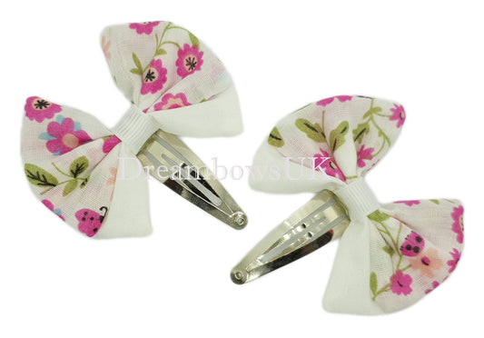 Floral hair bows on snap clips