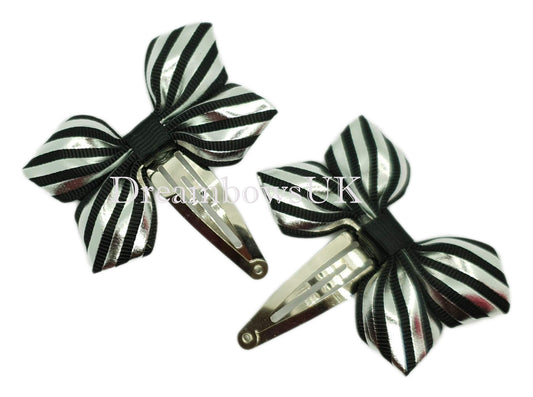 Black and silver striped hair bows on snap clips