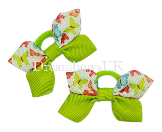 Lime green and white butterfly design hair bows on polyester bobbles