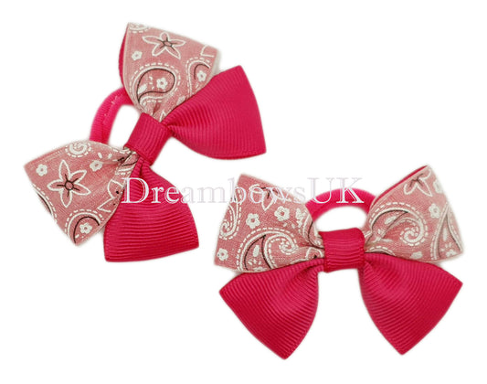 Cerise pink paisley design bows on polyester bobbles