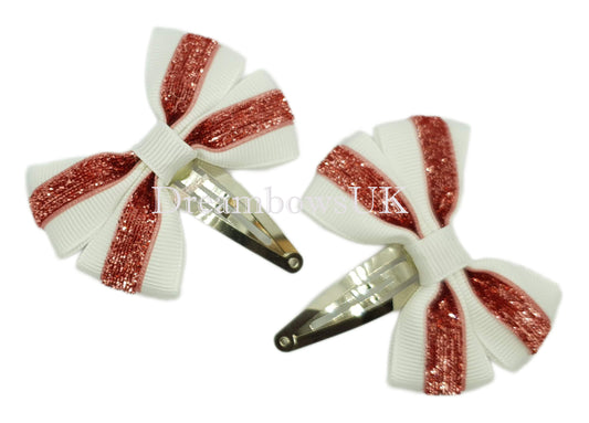 Pink and white glitter hair bows on snap clips