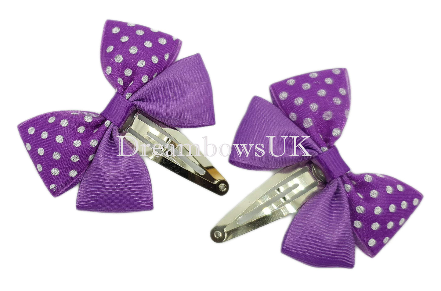 Purple polka dot hair bows on snap clips