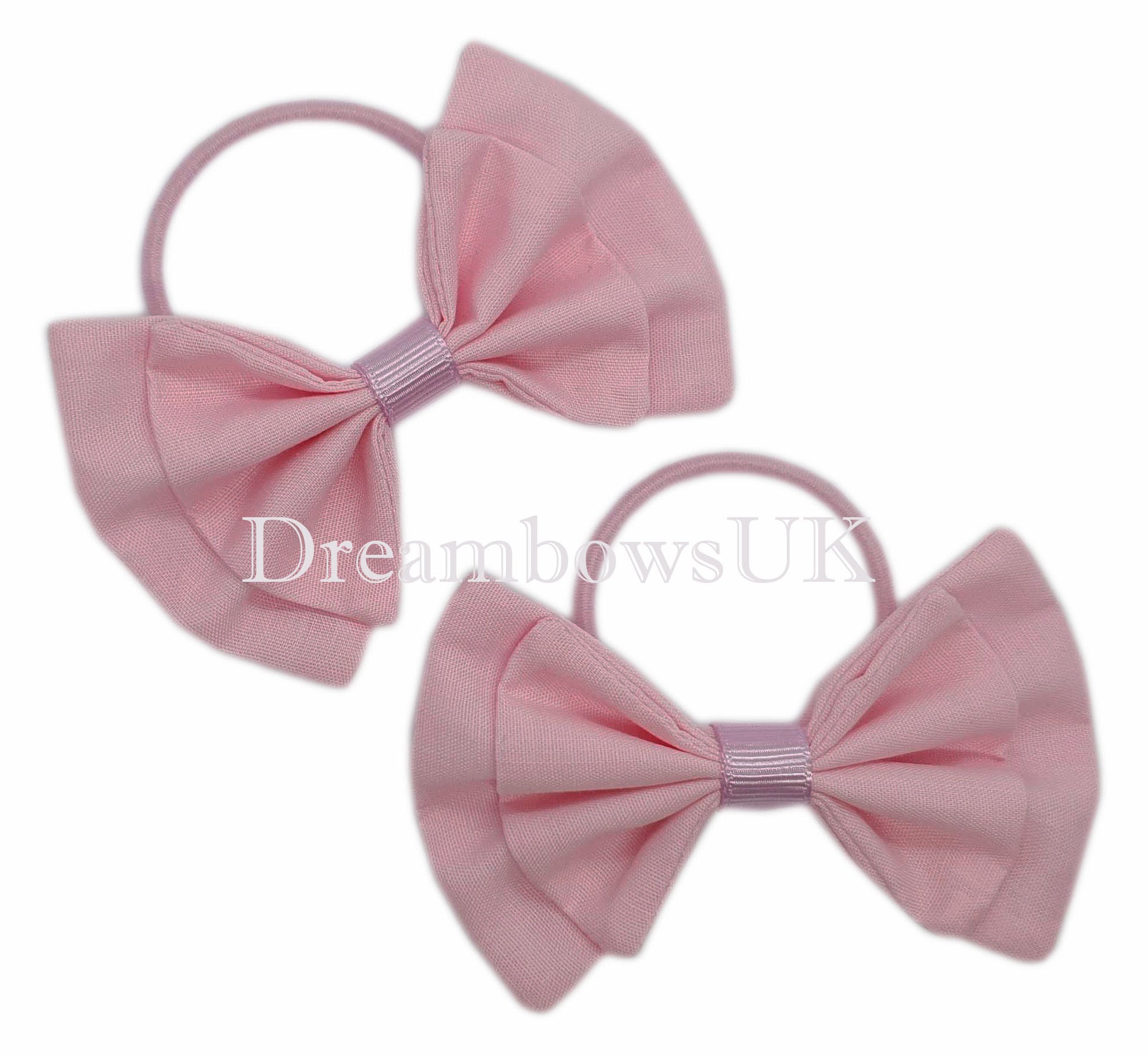 Light pink fabric hair bows on thin hair elastics