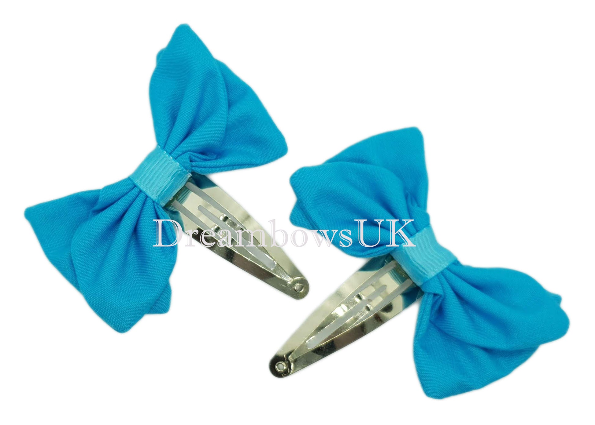 Handmade turquoise fabric hair bows on snap clips