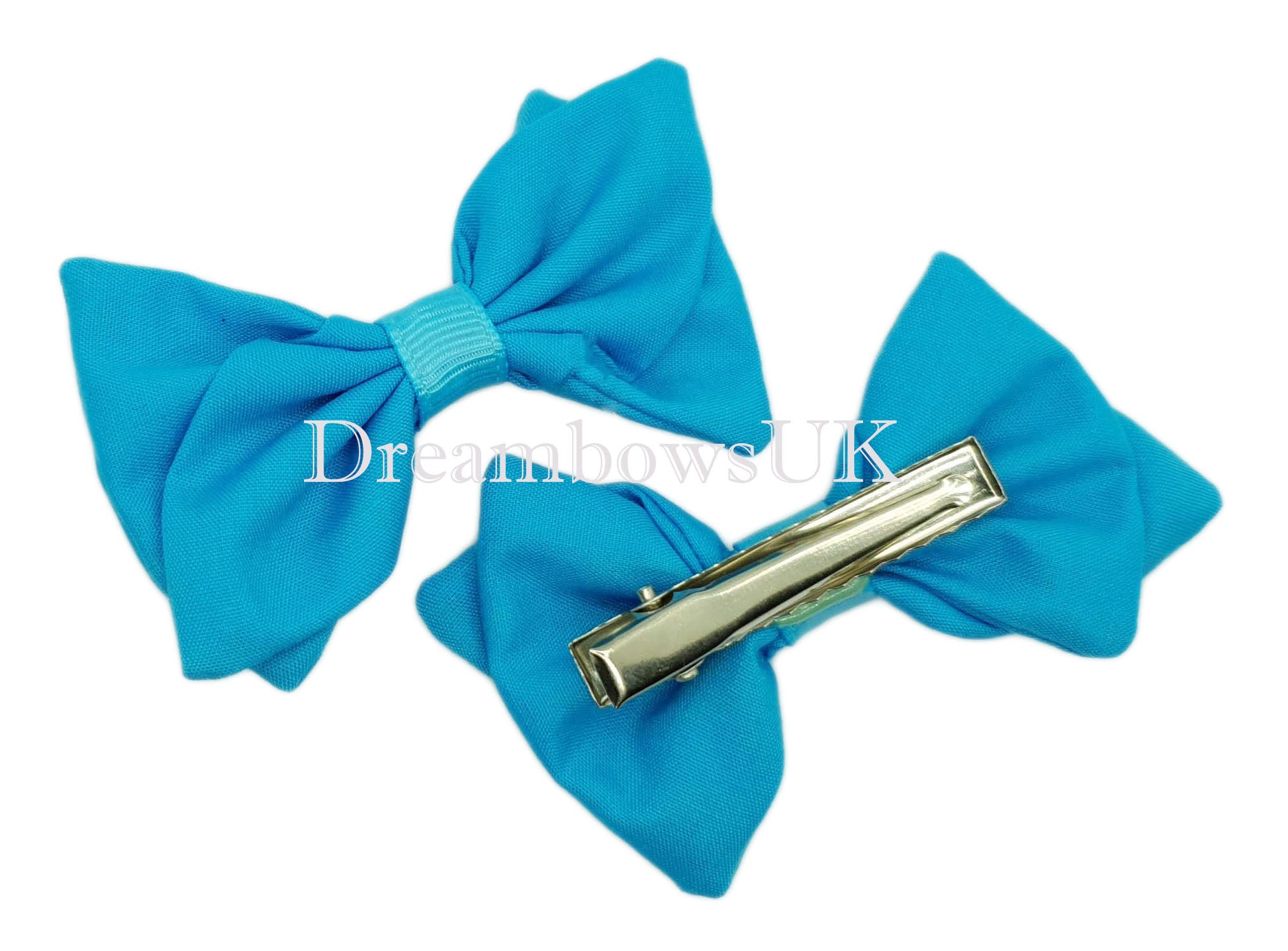 Girls turquoise fabric hair bows on alligator clips