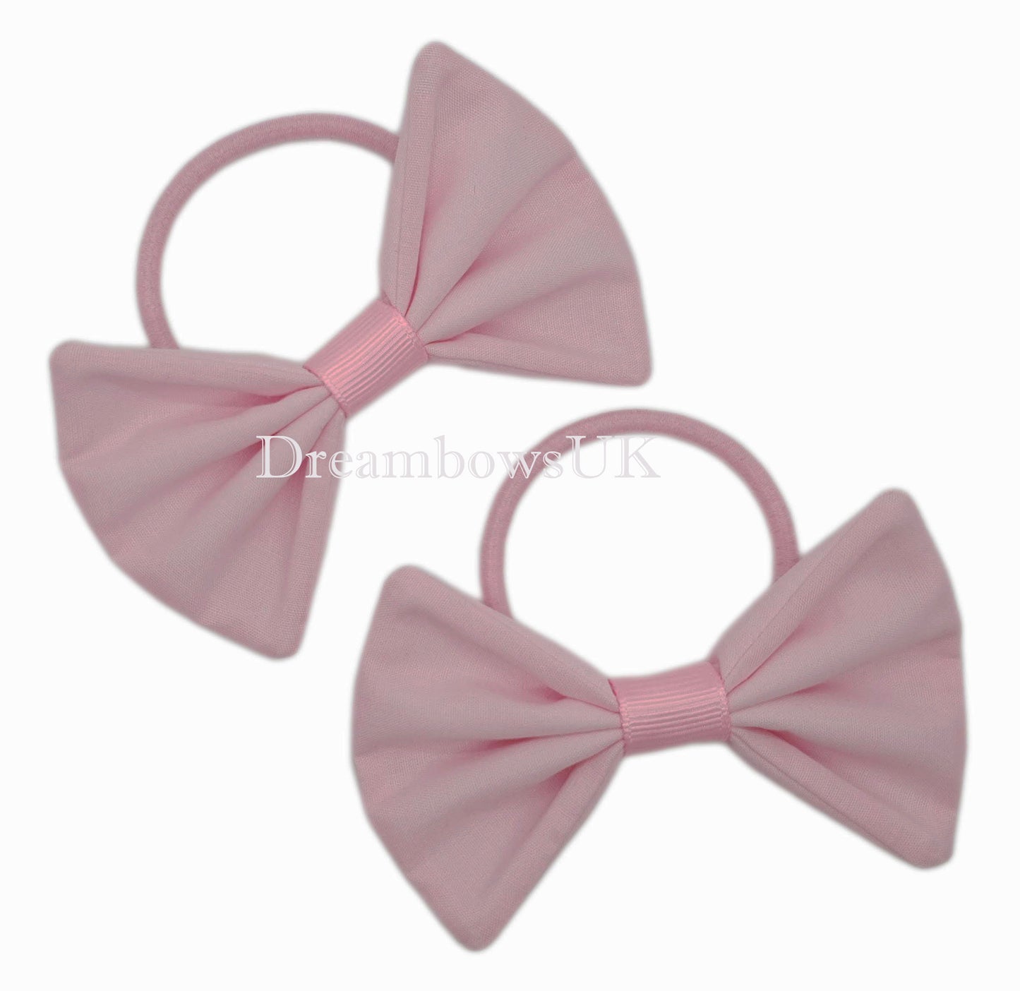 Baby pink fabric hair bows on thick hair bobbles
