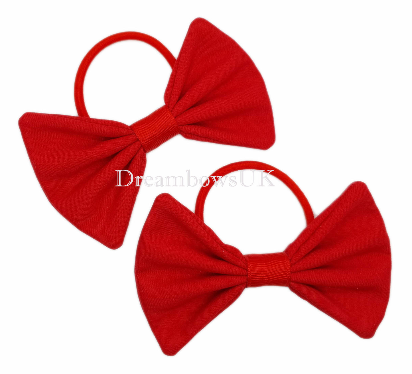Red fabric hair bows on thick hair elastics