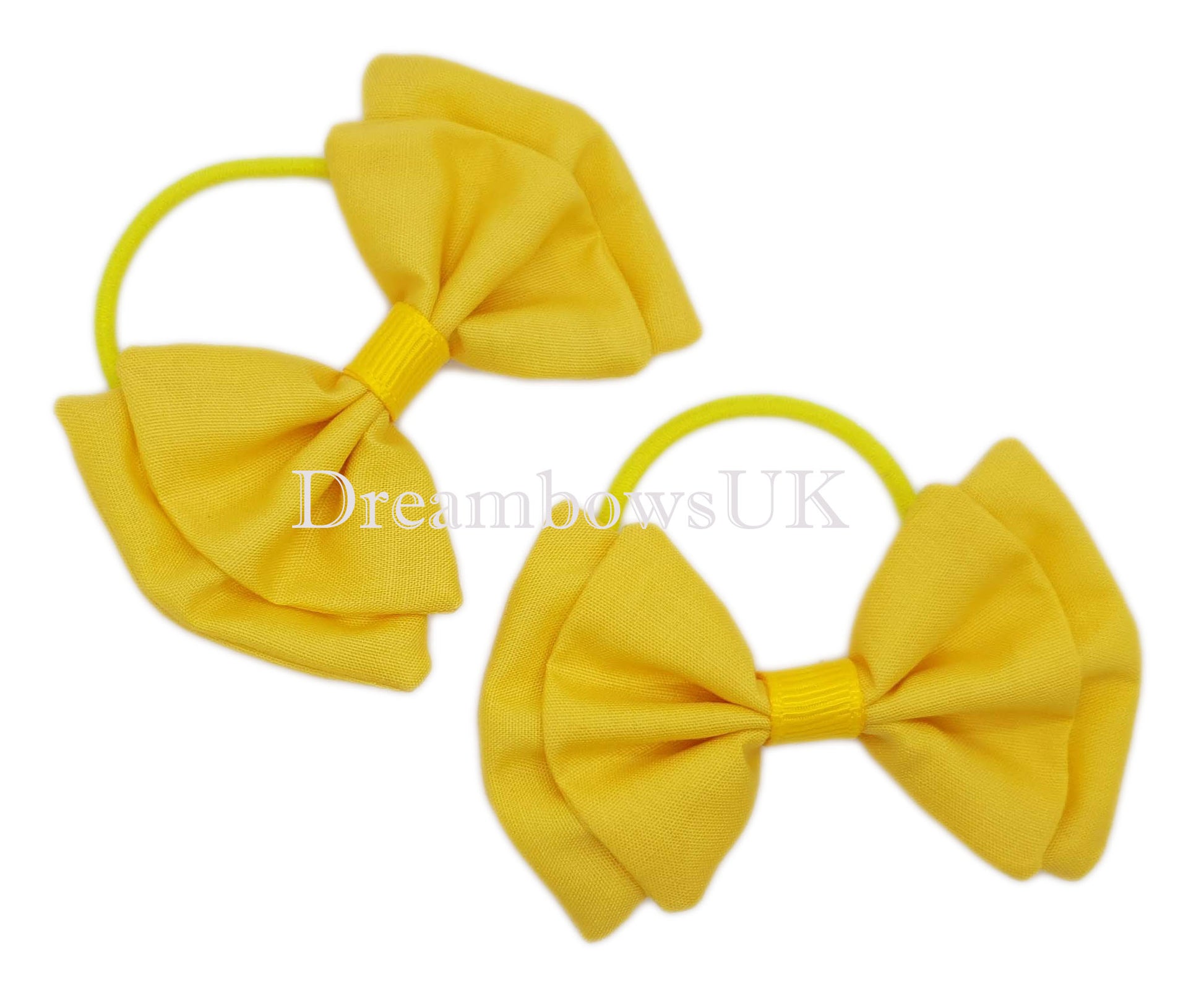 Golden yellow fabric hair bows on thin bobbles