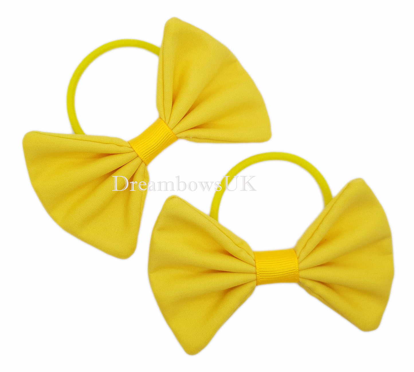 Golden yellow fabric school bows on thick bobbles