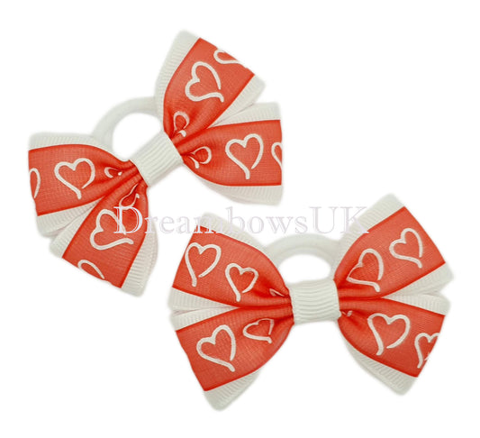 Red and white hearts design hair bows on polyester bobbles