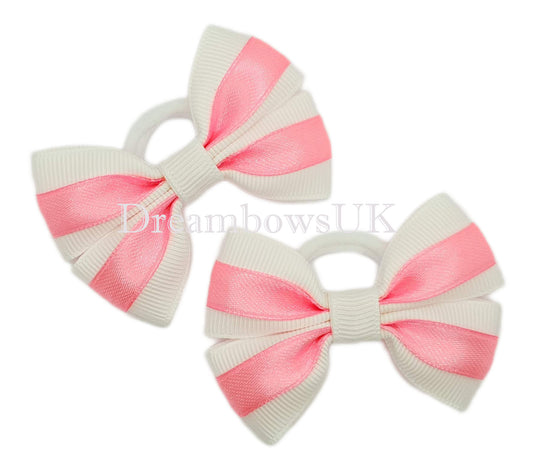 Pink and white satin bows on soft bobbles
