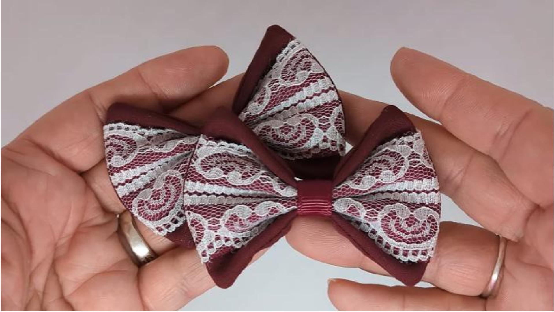 Close-up of burgundy and white lace hair bows on alligator clips, measuring 7cm x 5cm, showcasing the elegant lace design.