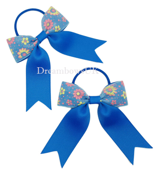 Royal blue floral hair bows on thin bobbles