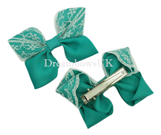 Jade green and white hair bows on alligator clips