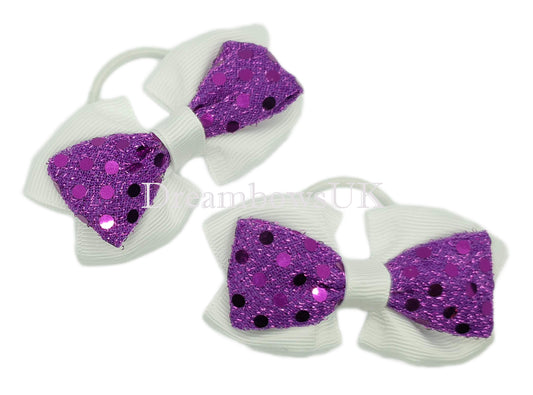 Purple and white diamante hair bows on thin bobbles