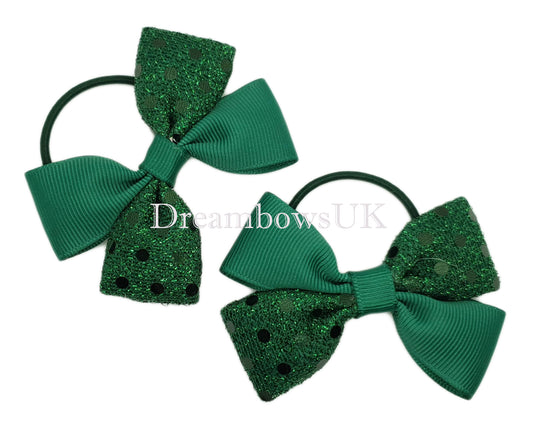 Bottle green diamante hair bows on thin bobbles