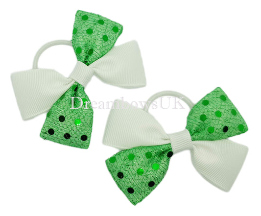 Emerald green and white diamante bows on thin bobbles