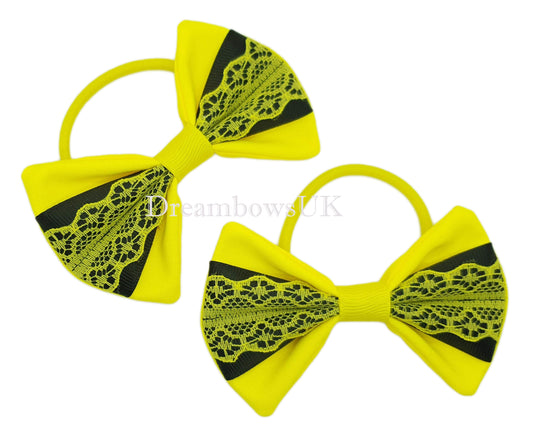 Black and yellow lace hair bows on thick bobbles