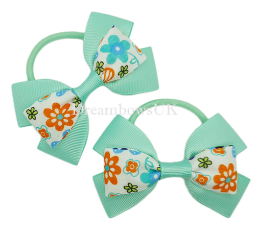 Pastel green floral hair bows on thick bobbles