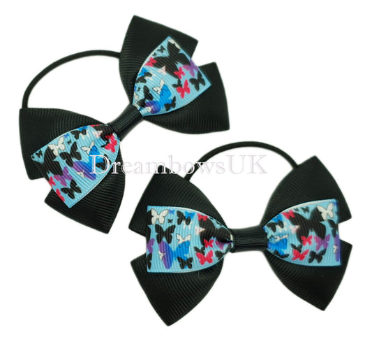 Black and blue hair bows, butterflies, thin bobbles