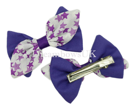 Purple and white hair bows on alligator clips