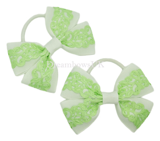 Pastel green and white novelty bows on thick bobbles